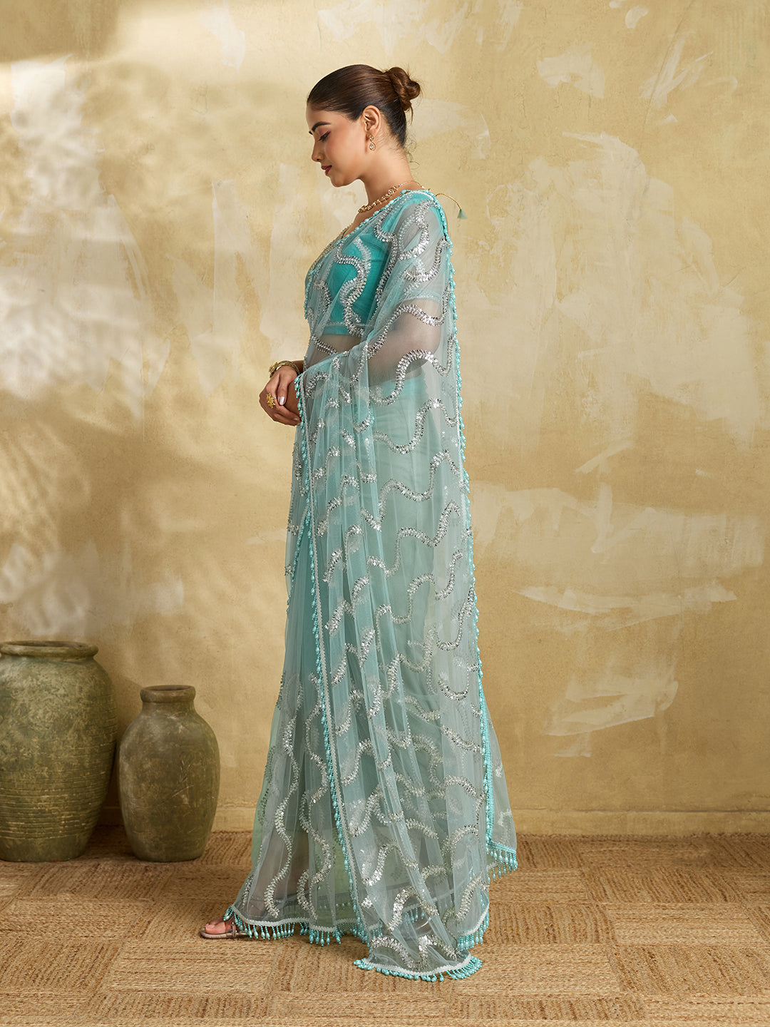 Sea Green Net Saree with Silver Sequin Wave Embroidery and Tasseled Border