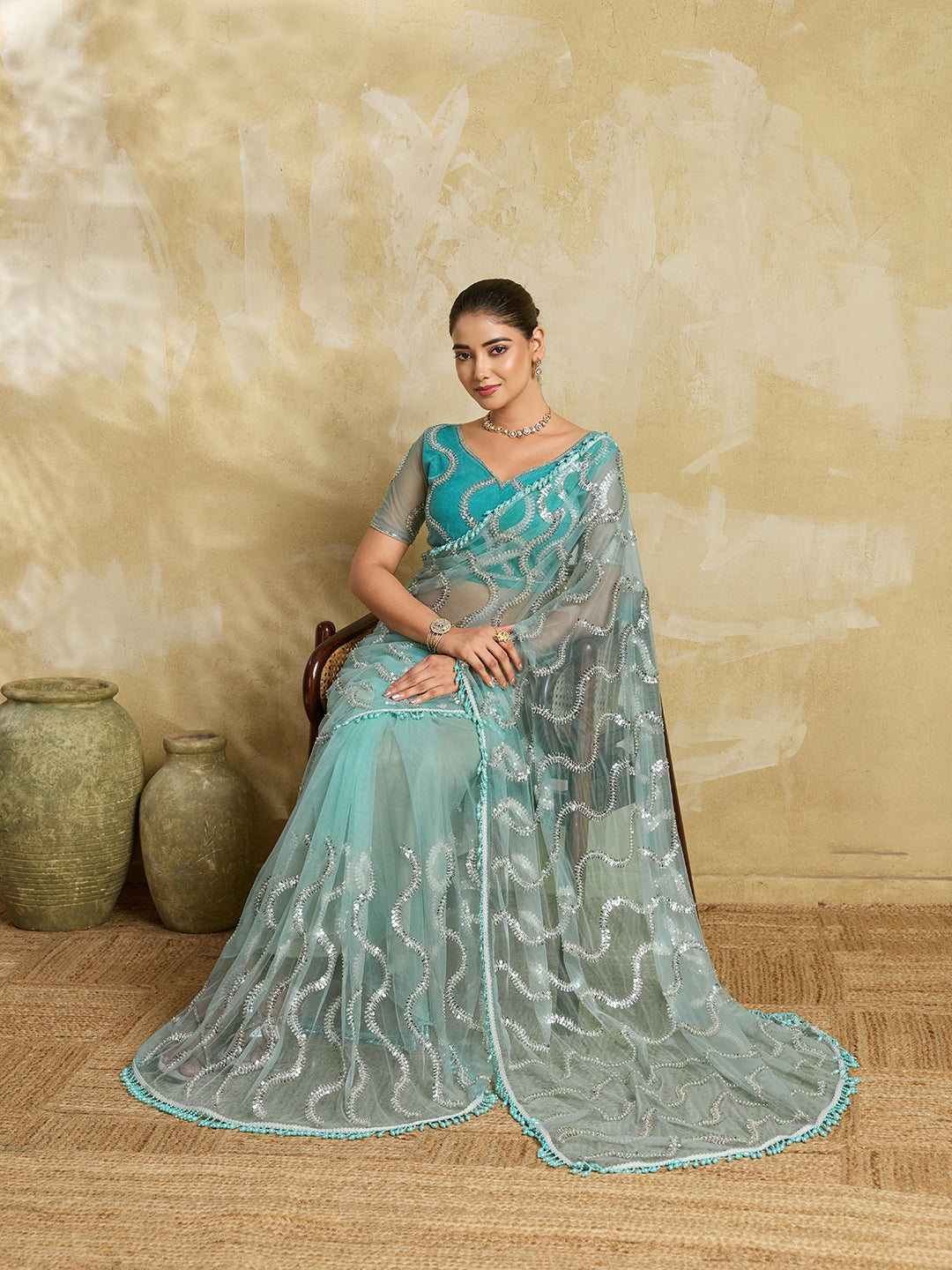 Sea Green Net Saree with Silver Sequin Wave Embroidery and Tasseled Border