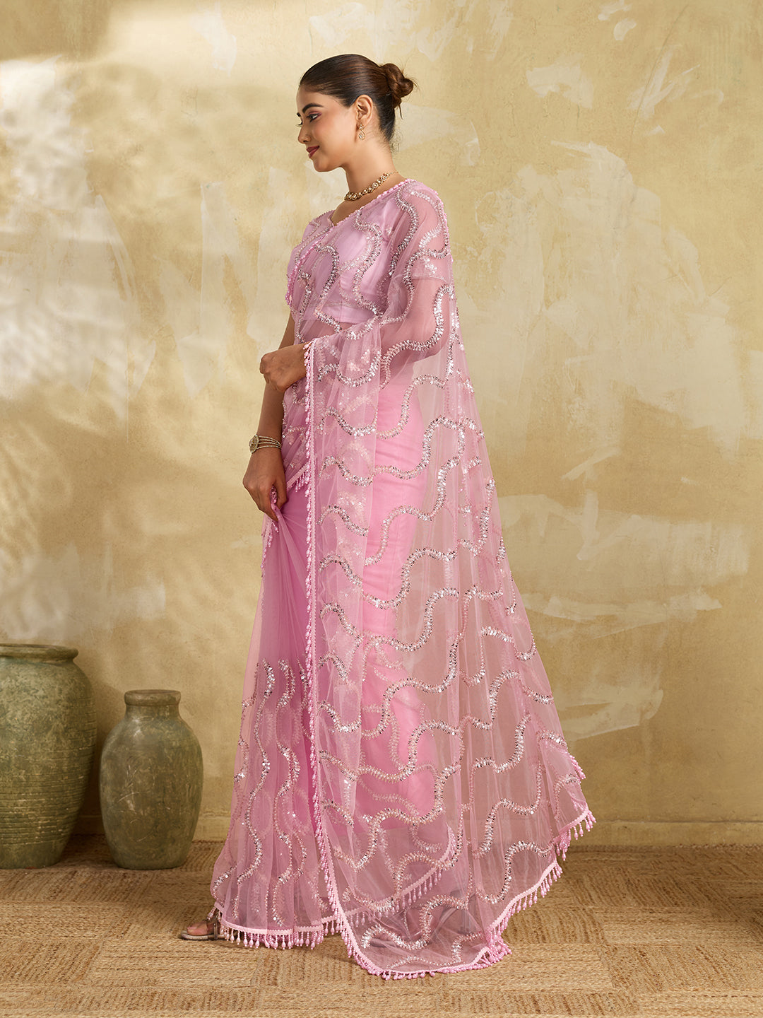 Pink Net Saree with Silver Sequin Wave Embroidery and Tasseled Border