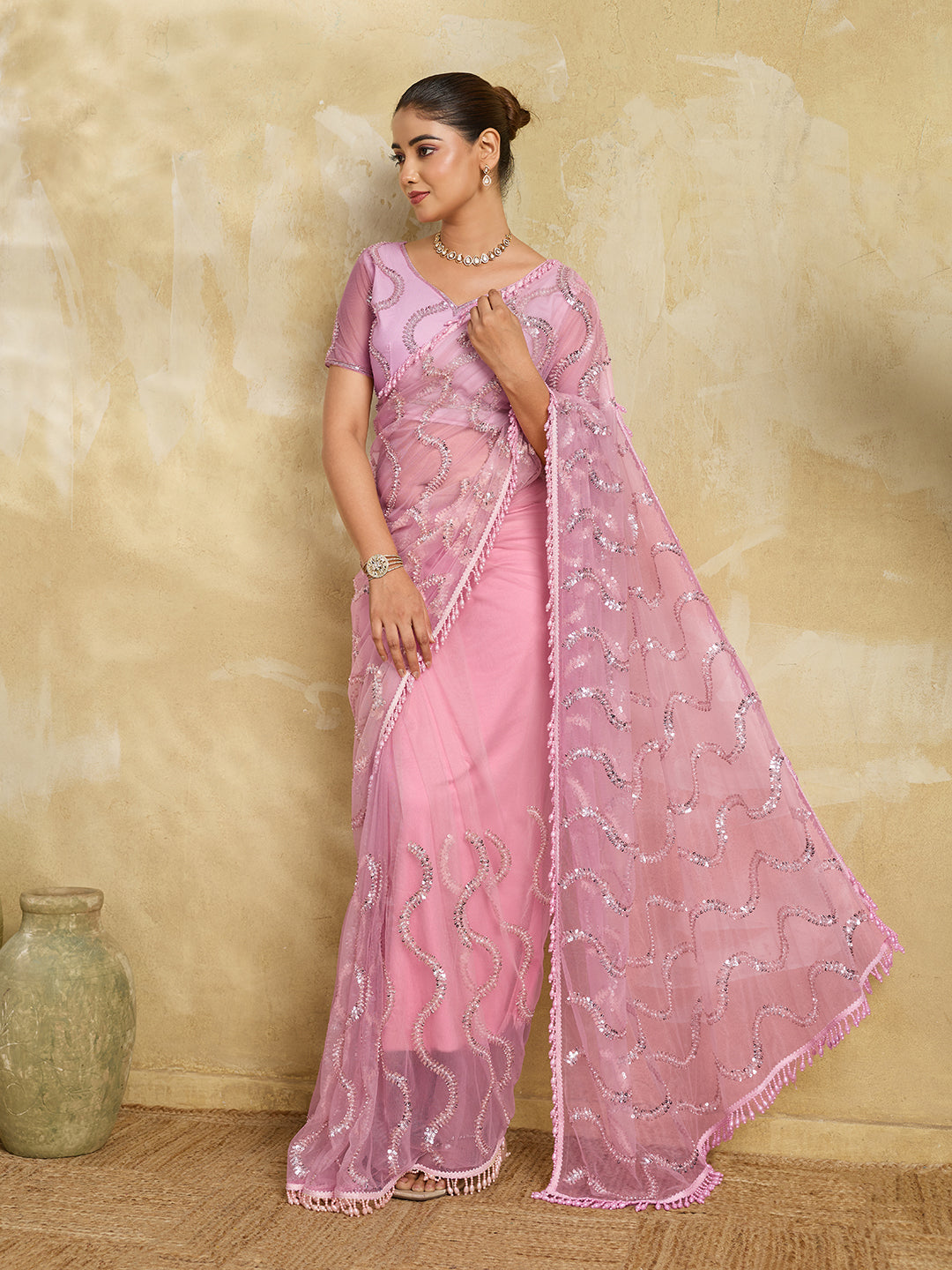 Pink Net Saree with Silver Sequin Wave Embroidery and Tasseled Border