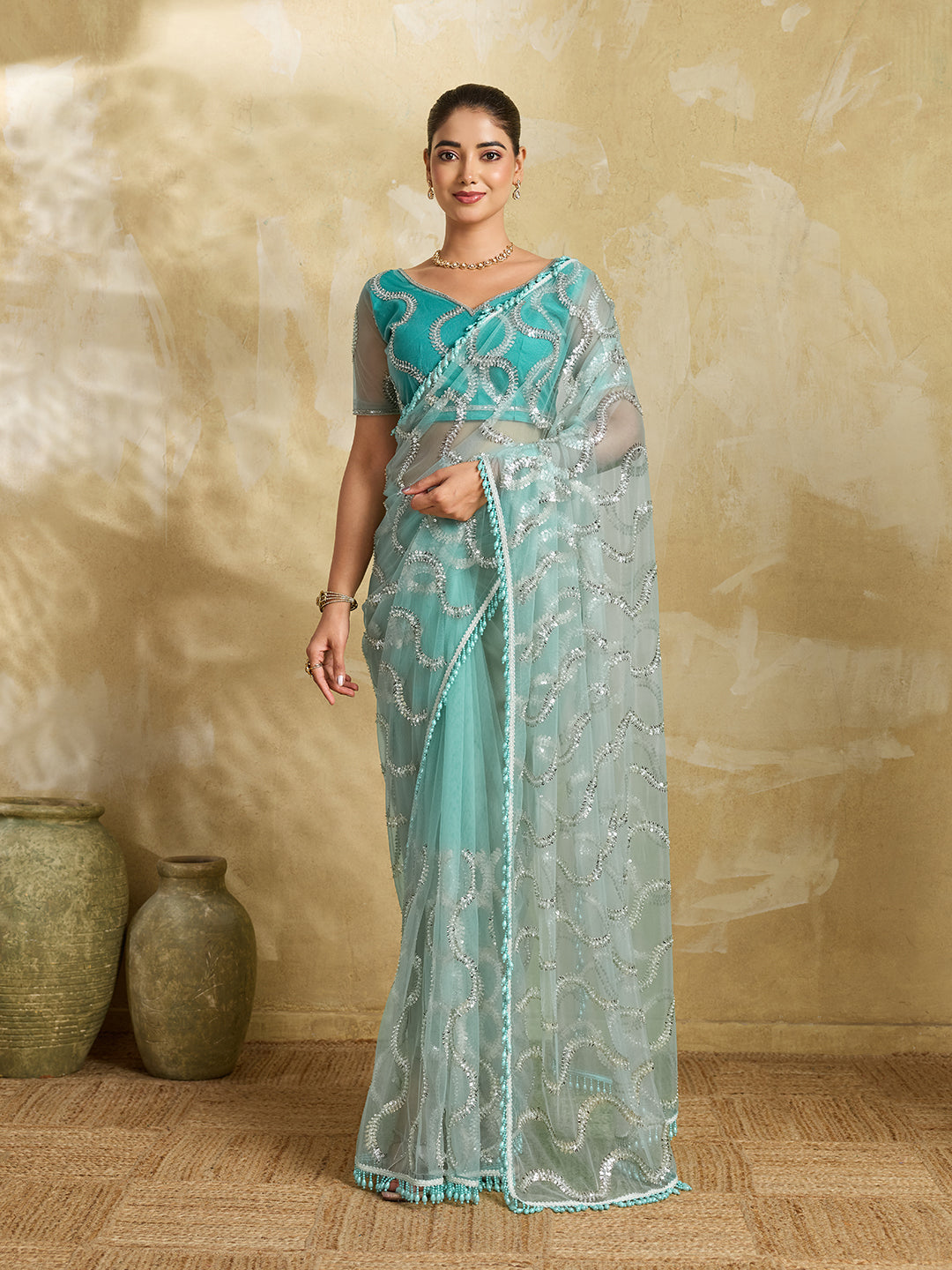 Sea Green Net Saree with Silver Sequin Wave Embroidery and Tasseled Border