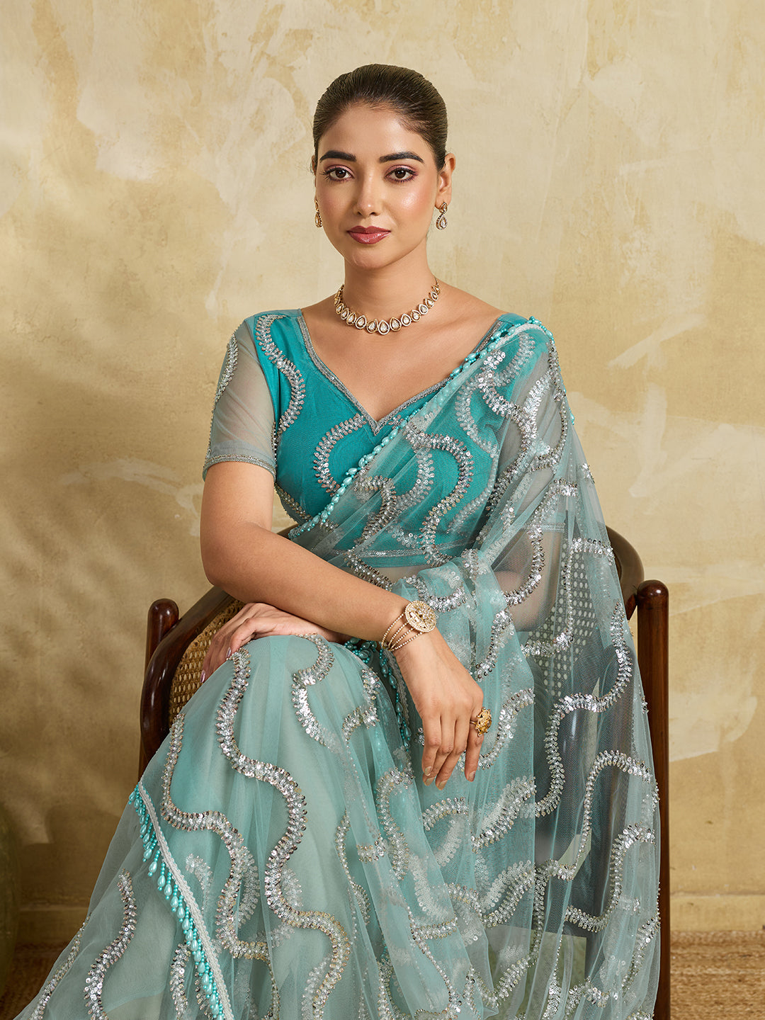 Sea Green Net Saree with Silver Sequin Wave Embroidery and Tasseled Border