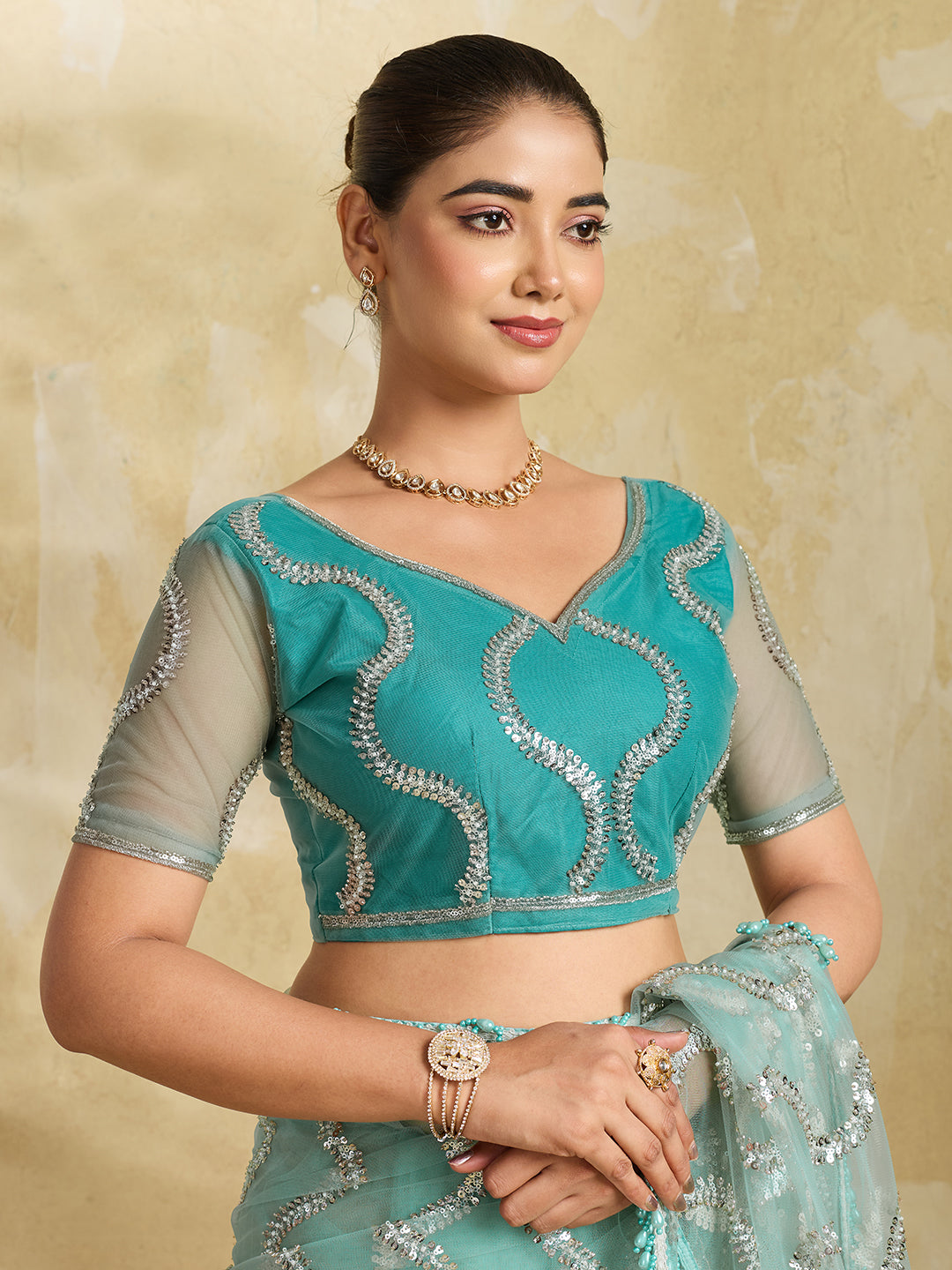 Sea Green Net Saree with Silver Sequin Wave Embroidery and Tasseled Border
