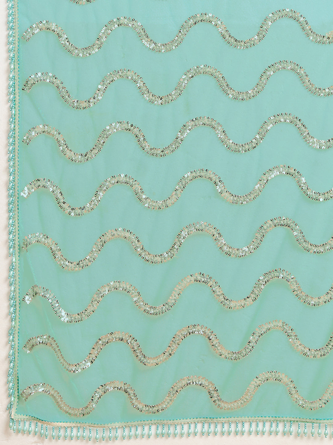 Sea Green Net Saree with Silver Sequin Wave Embroidery and Tasseled Border