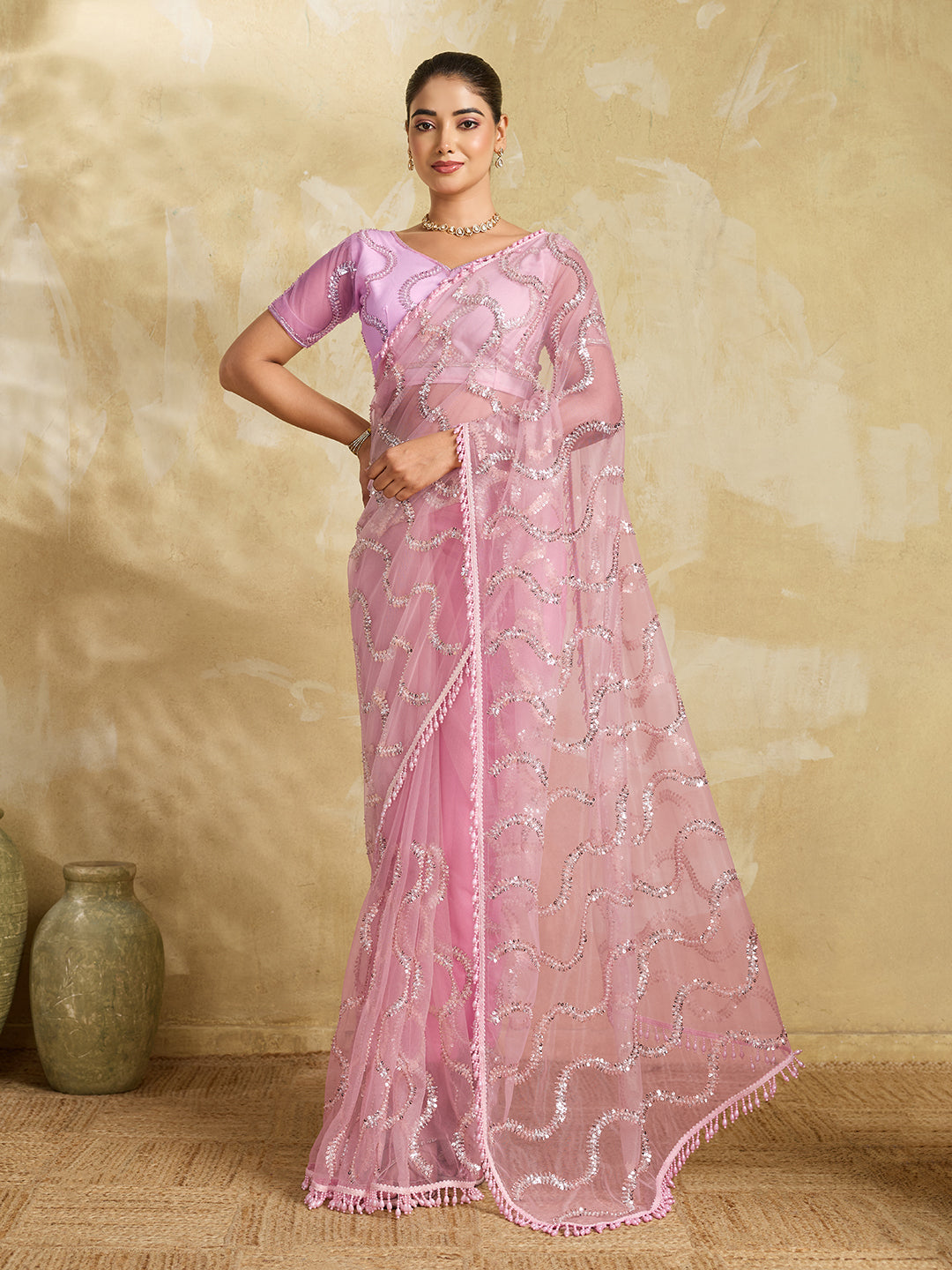 Pink Net Saree with Silver Sequin Wave Embroidery and Tasseled Border