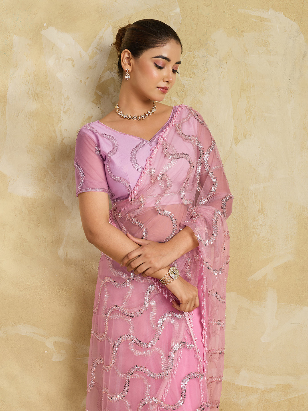 Pink Net Saree with Silver Sequin Wave Embroidery and Tasseled Border