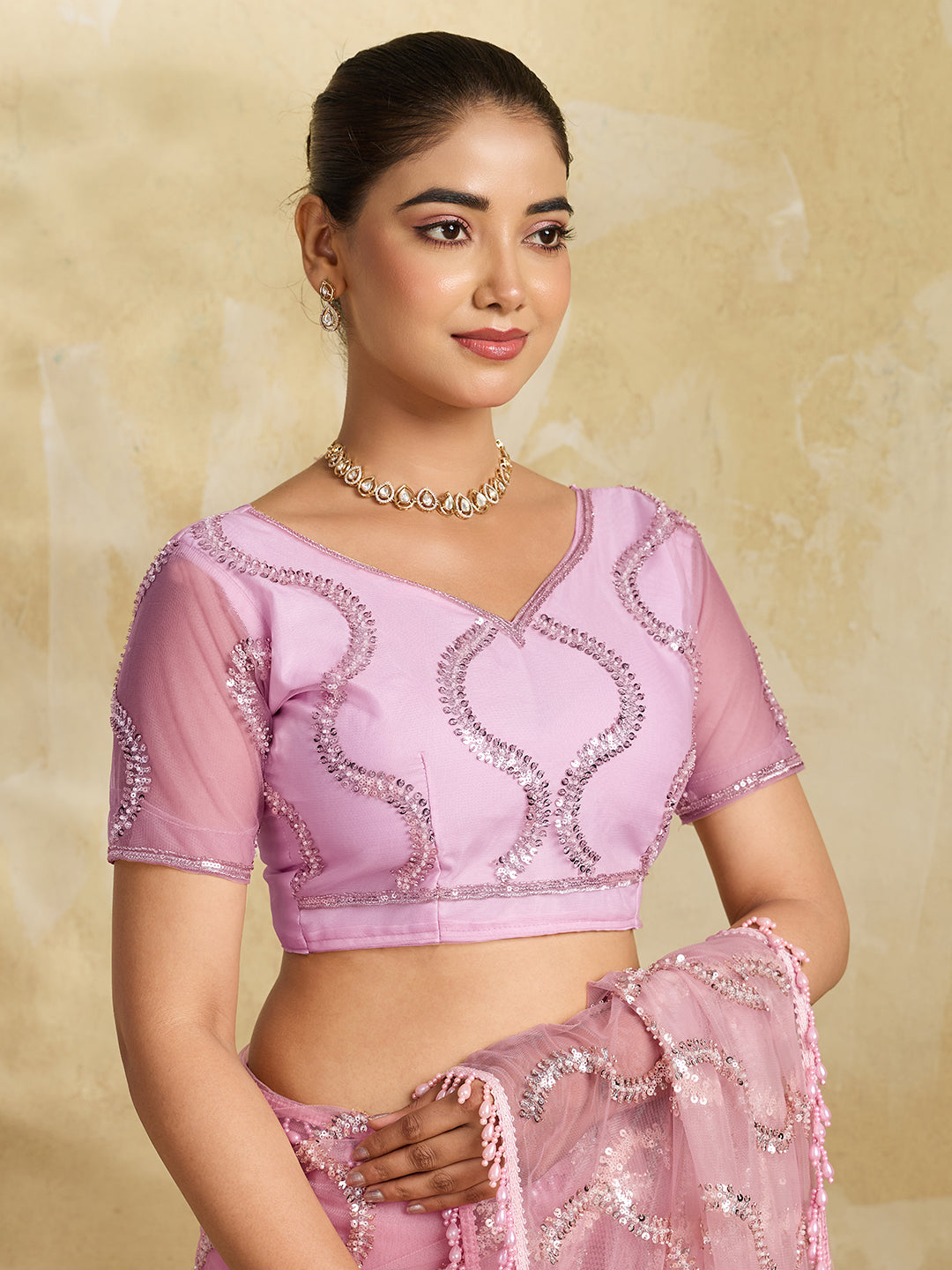 Pink Net Saree with Silver Sequin Wave Embroidery and Tasseled Border